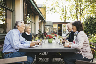 Friends sitting on table