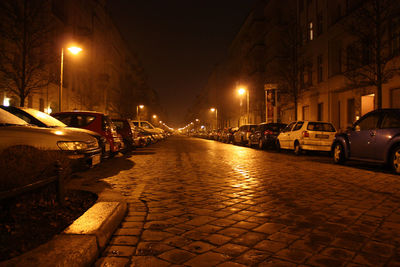 Illuminated street lights at night