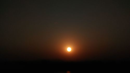 Scenic view of moon in sky during sunset