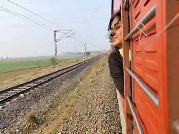 Train on railroad track against sky