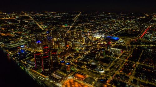 Aerial view of city lit up at night