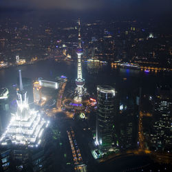 High angle view of illuminated city buildings at night