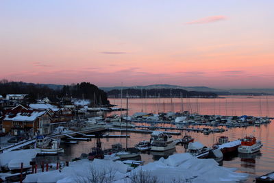 High angle view of sea against sky at sunset