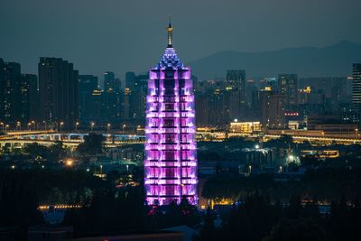 Illuminated buildings in city at night