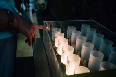 Close-up of lit candles in the dark