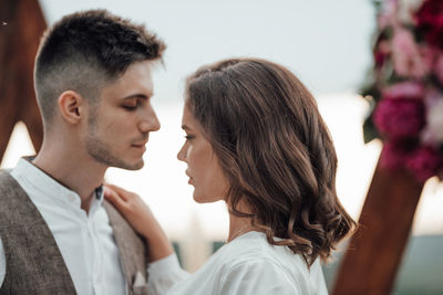 Side view of couple kissing