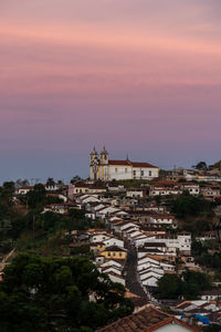 High angle view of buildings against sky during sunset