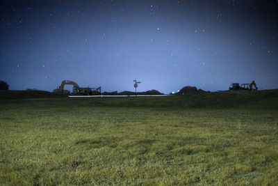 Scenic view of landscape against sky at night