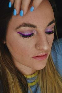 Close-up of thoughtful woman with make-up