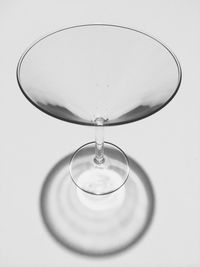 Close-up of wineglass on white background