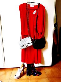 Full length of man standing in red shoes