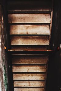 Staircase against brick wall