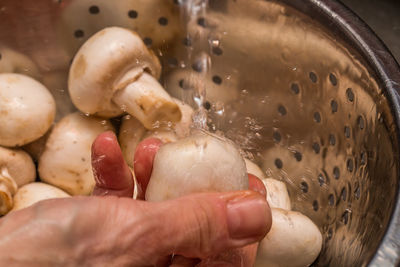 Close-up of hand holding ice cream