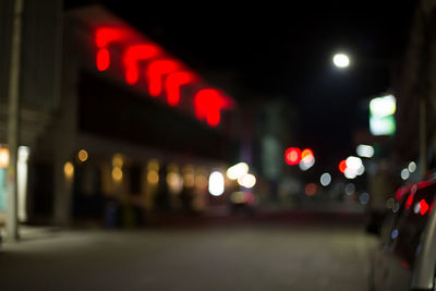 Defocused image of illuminated city at night