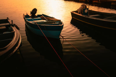 Boats moored in lake