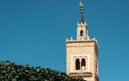 Low angle view of church against clear blue sky