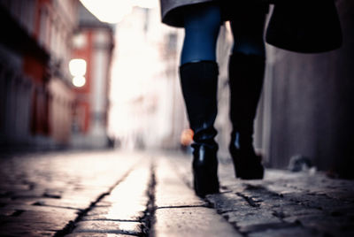 Surface level shot of woman walking on street