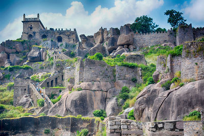 View of old ruins against cloudy sky