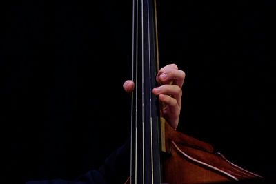 Cropped hand playing cello