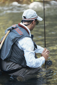 Man fishing in lake