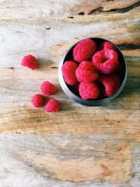 High angle view of strawberries in bowl on table