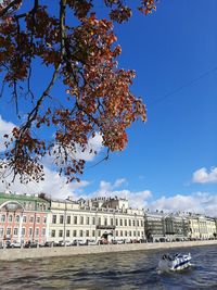 View of buildings against blue sky