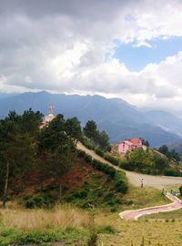 Scenic view of landscape and mountains against sky