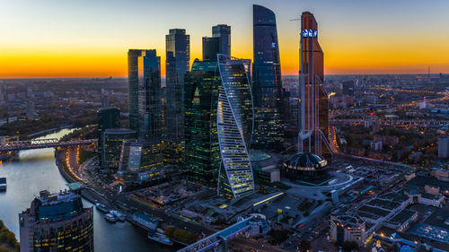 High angle view of city buildings during sunset