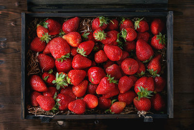 High angle view of strawberries in box