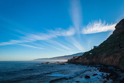 Wind clouds over the calm coast of tenerife