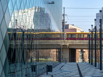 Bridge in city against sky