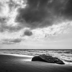 Scenic view of sea against cloudy sky