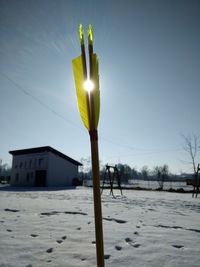 Close-up of snow against clear sky