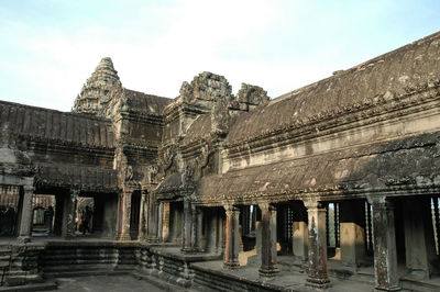 Exterior of old temple building against sky