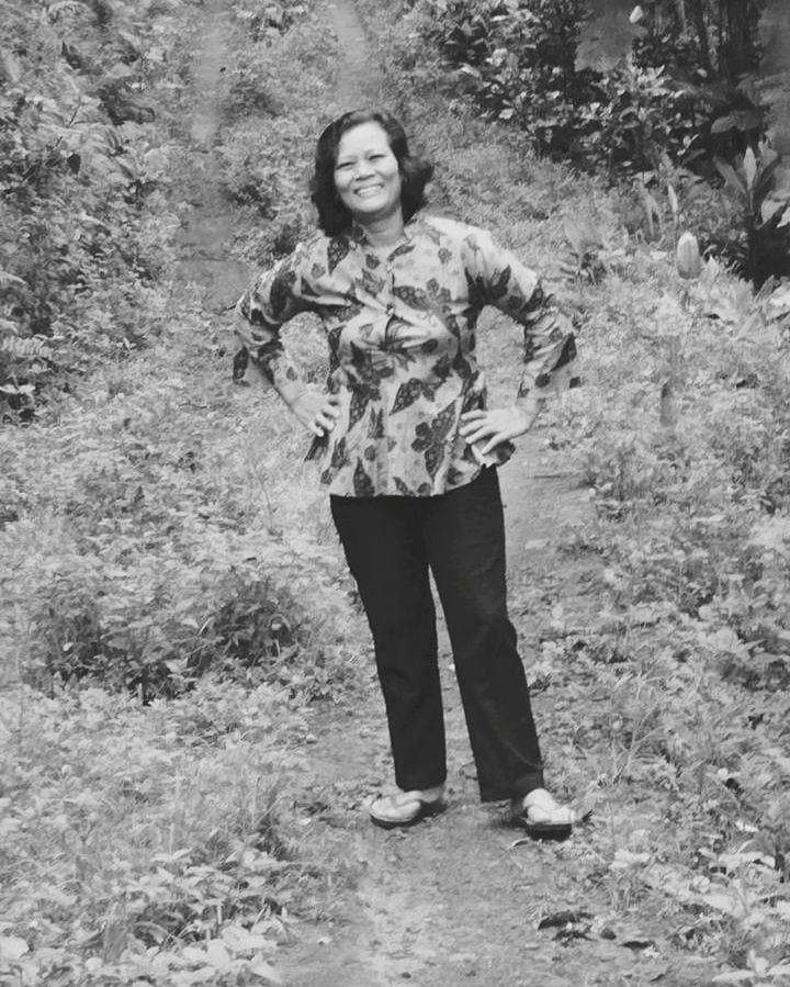 one person, full length, black and white, standing, front view, leisure activity, portrait, lifestyles, young adult, land, casual clothing, plant, looking at camera, nature, day, monochrome photography, women, monochrome, adult, smiling, clothing, tree, person, outdoors, field, female, child, growth, happiness, forest, emotion