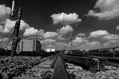 Train on railroad track against sky