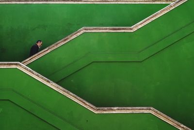 High angle view of woman standing on staircase