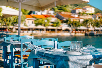 Empty chairs and tables in restaurant