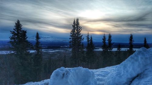 Scenic view of snow covered mountains against sky