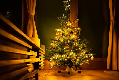 Illuminated christmas tree at home