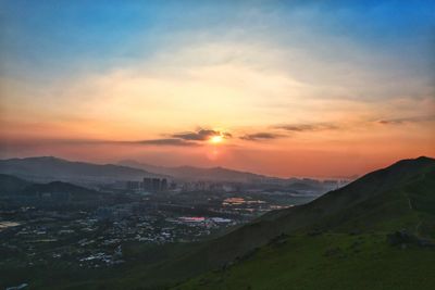 Scenic view of landscape against sky during sunset