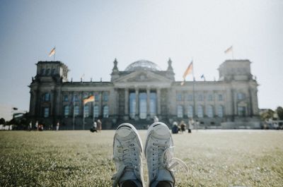 Low section of people in front of building