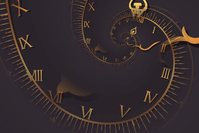 Close-up of clock against black background