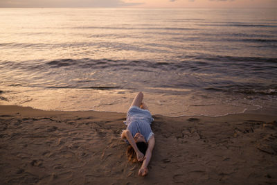 Full length of woman on beach