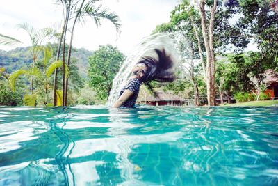 Portrait of young woman in swimming pool