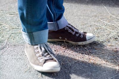 Low section of woman standing on tiled floor