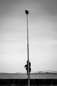 Street light against sky