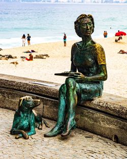 Statue of people on beach