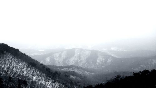 Scenic view of mountains against sky during winter