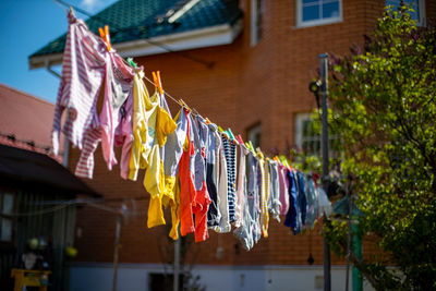 Low angle view of clothes drying outside building